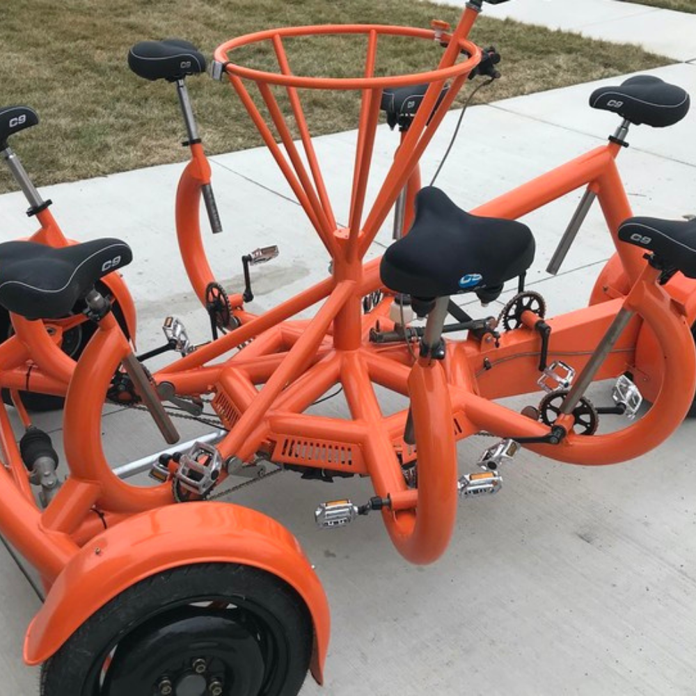 Orange pedal pub used for Traverse City touring provided by TC Cycle Pub
