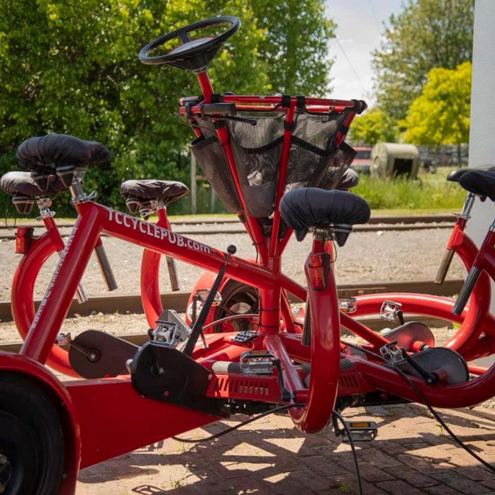 Red pedal pub used for Traverse City sightseeing provided by TC Cycle Pub